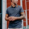 BRACKET Polo Dark Grey Orange Stripe - S